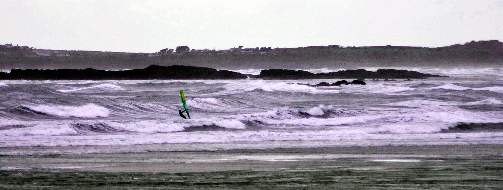 A windsurfer at Traeth Crigyll